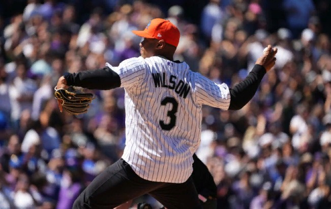 Watch: Russell Wilson Throws Out First Pitch At Rockies Opening Day